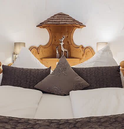 Bett im Doppelzimmer Gipfelgaudi im Hotel Vermala