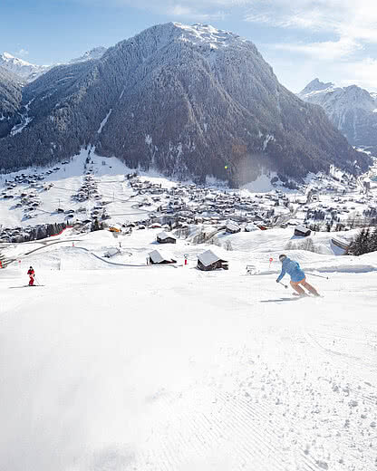 Skiers on the Gaschurn valley run